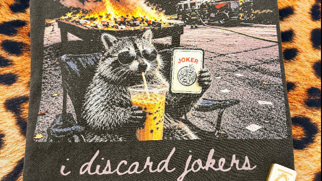 Card with a raccoon illustration and text on a leopard print surface